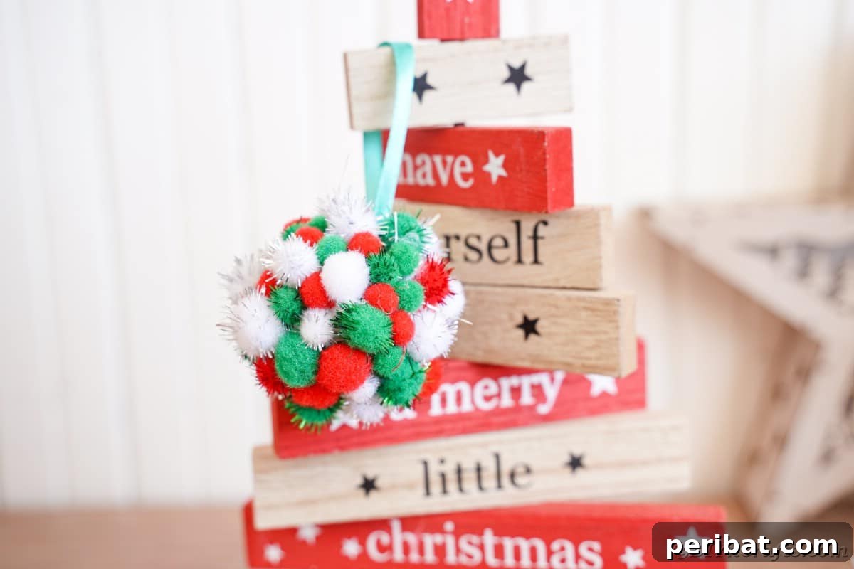 Craft Your Own Fluffy Pom Pom Christmas Ornaments 3 Ornament on wooden tree