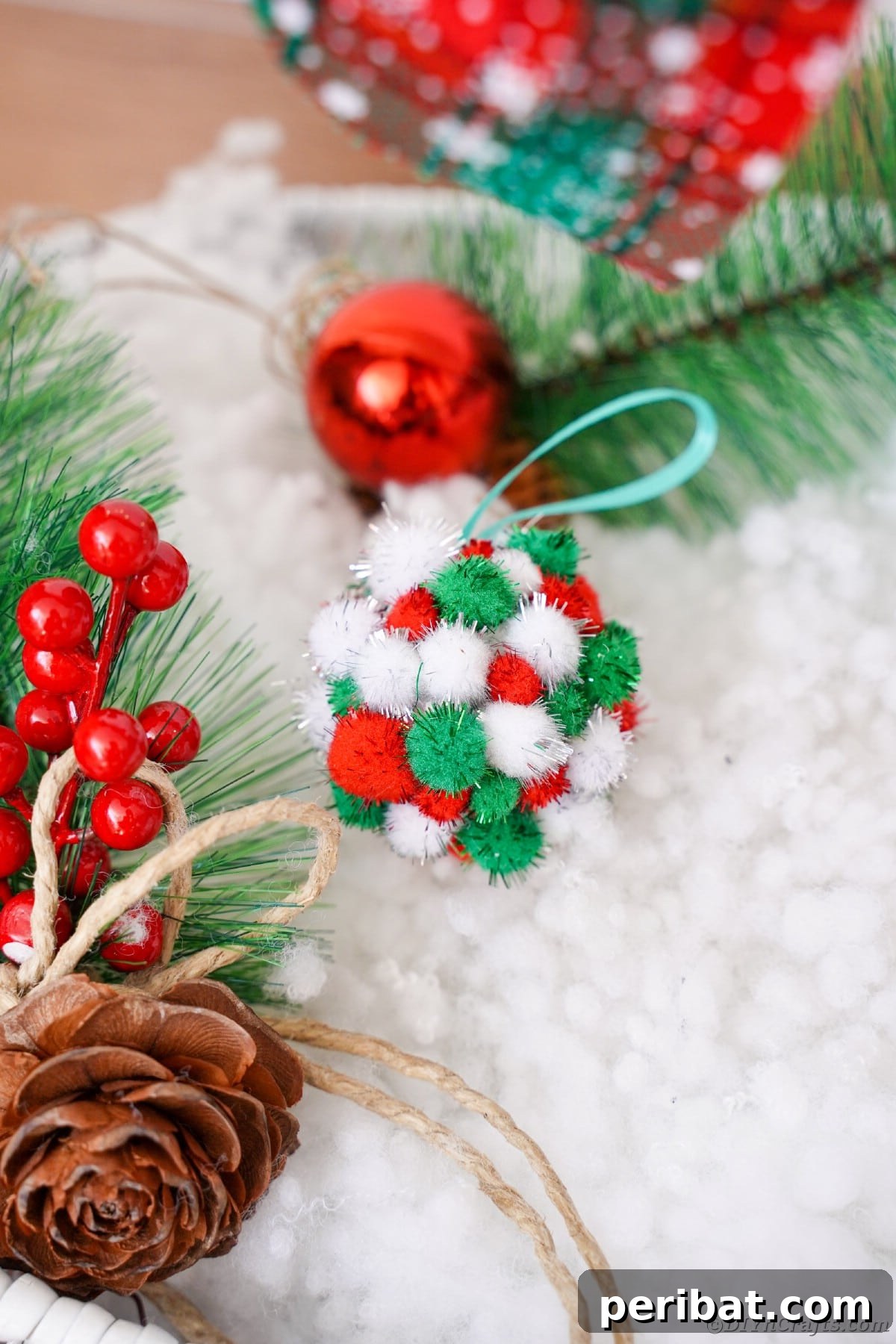 Craft Your Own Fluffy Pom Pom Christmas Ornaments 12 Pom Pom ornament on fake snow