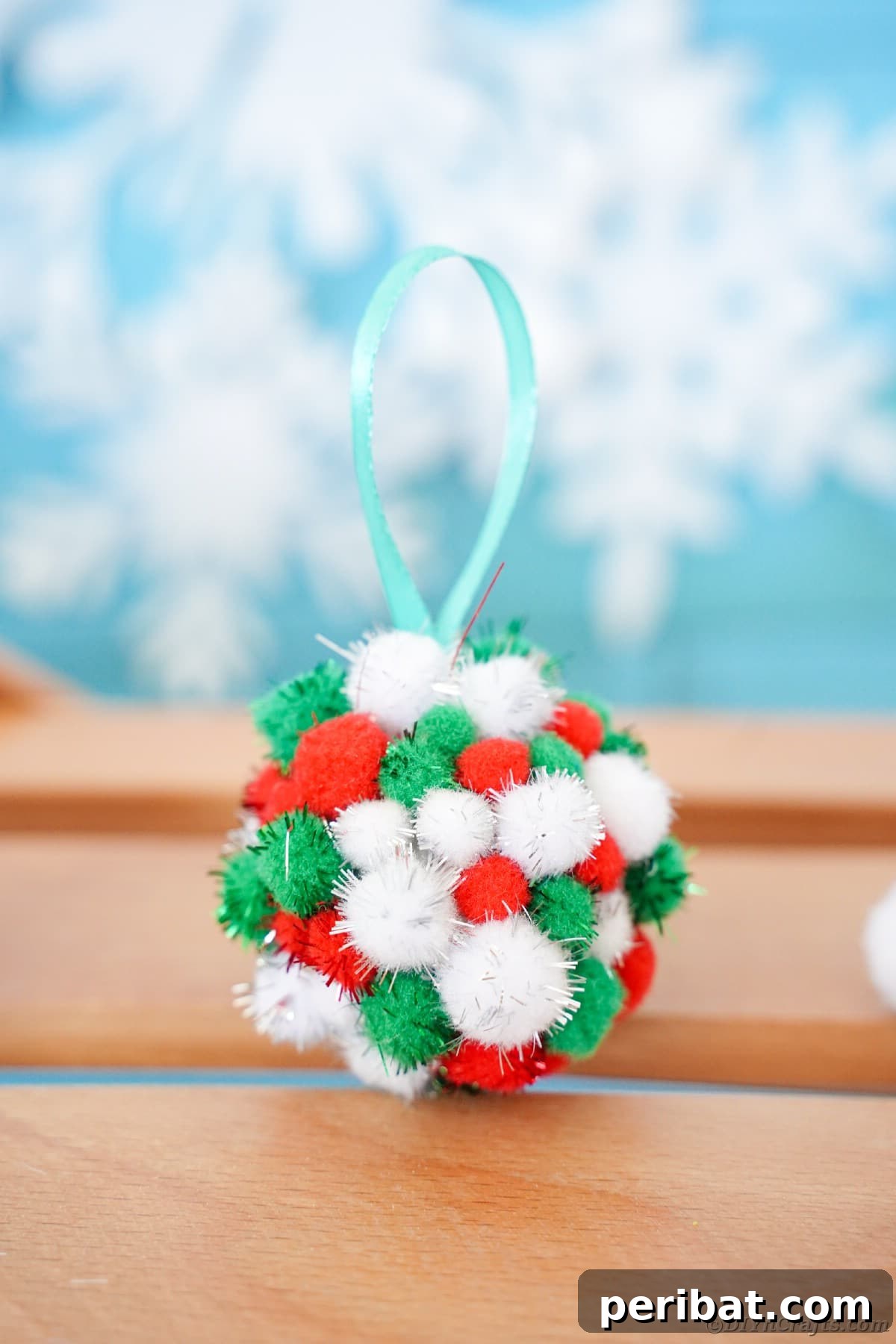 Craft Your Own Fluffy Pom Pom Christmas Ornaments 14 Ornament on table