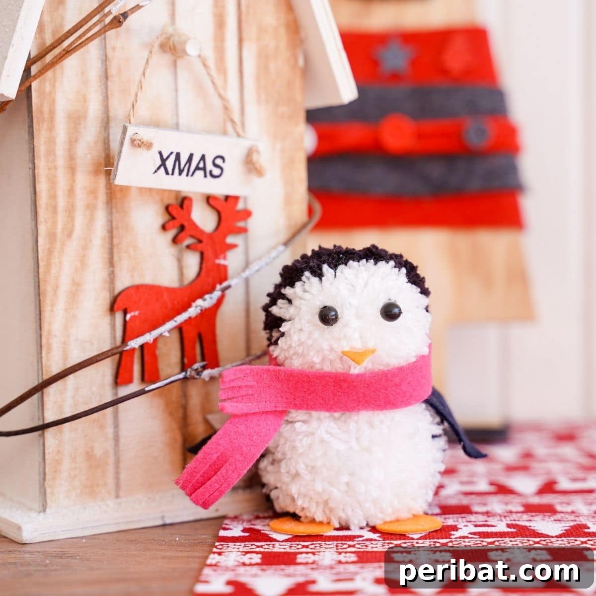Handmade Pom Pom Penguin Winter Charm 2 Handmade pom pom penguin decoration on wooden block