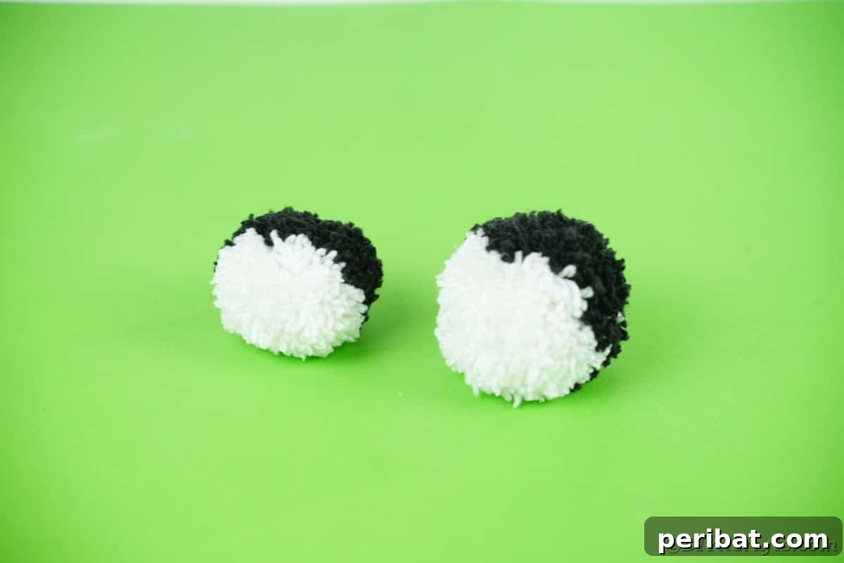 Handmade Pom Pom Penguin Winter Charm 14 Two black and white pom poms for a penguin craft