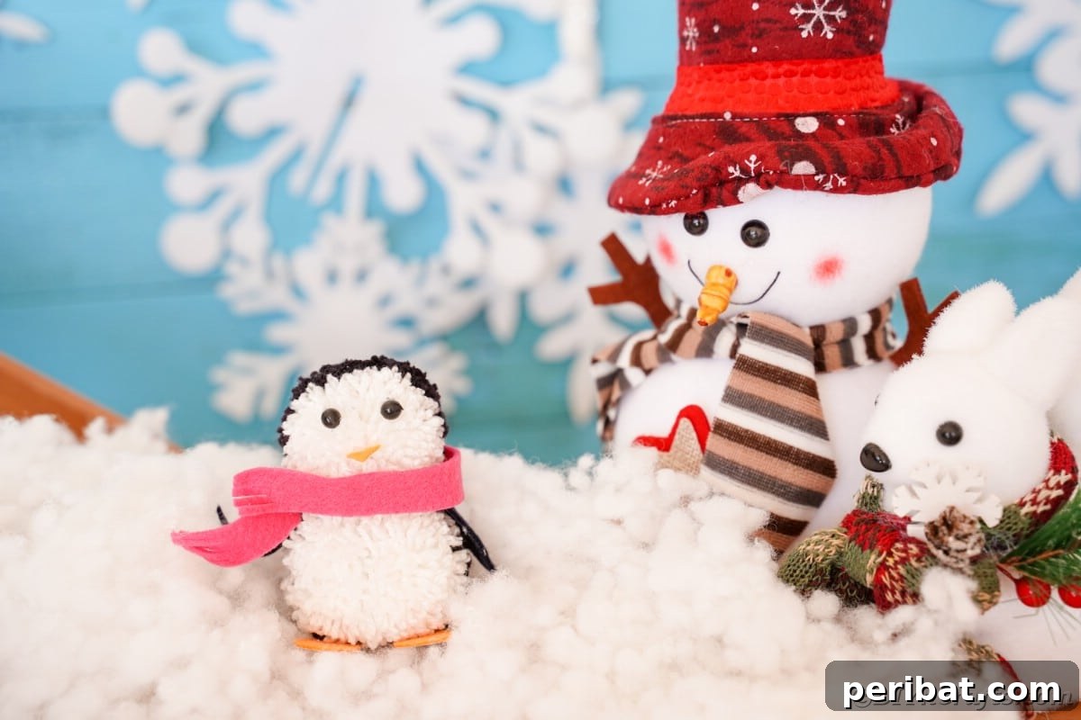 Handmade Pom Pom Penguin Winter Charm 4 Handmade pom pom penguin with a red scarf on a snowy background