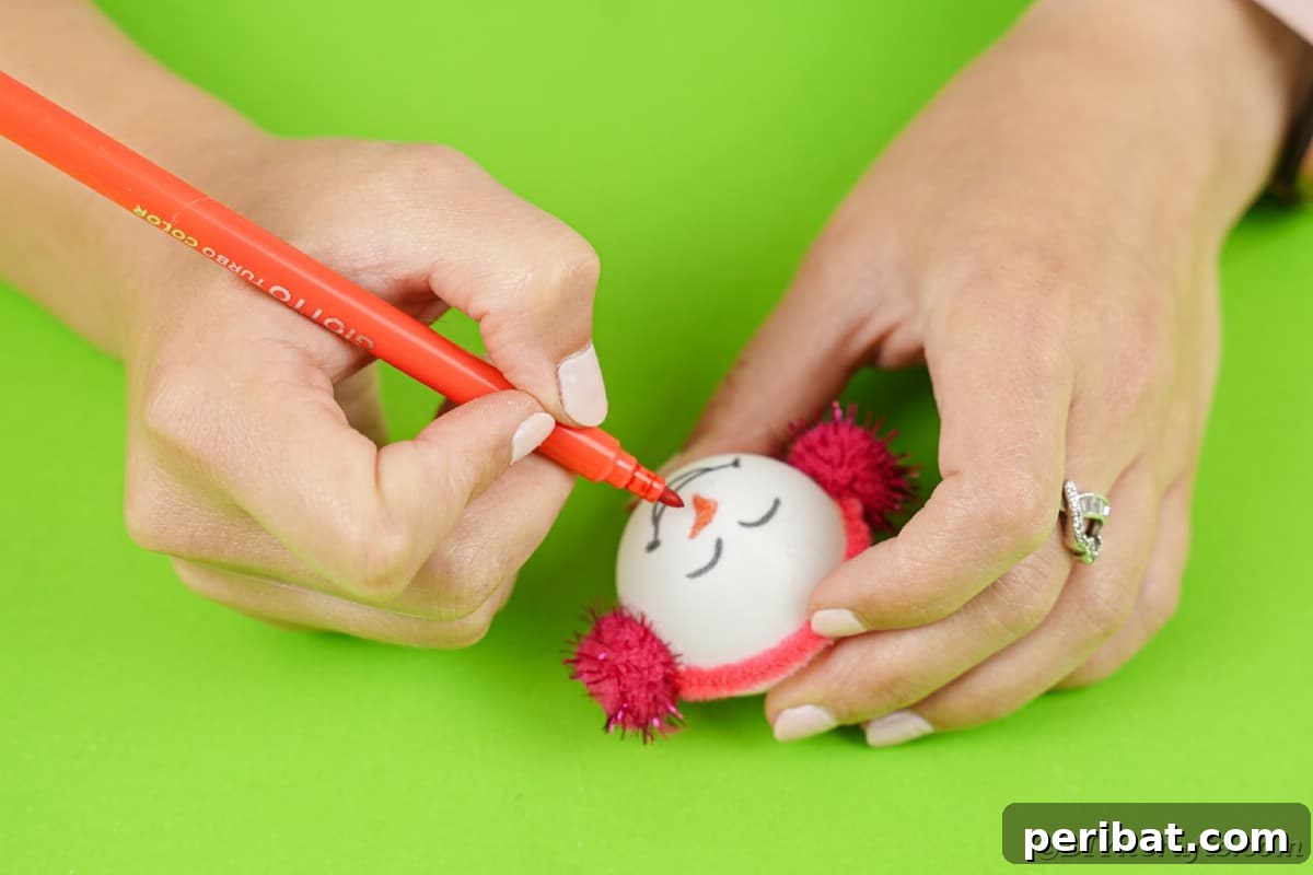 Handcrafted Ping Pong Snowman Holiday Ornaments 13 Drawing face on ping pong ball ornament
