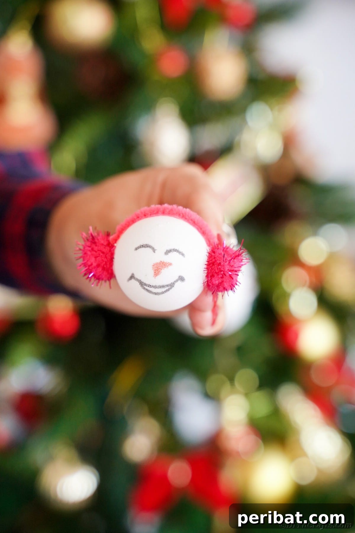 Handcrafted Ping Pong Snowman Holiday Ornaments 16 Woman holding ornament