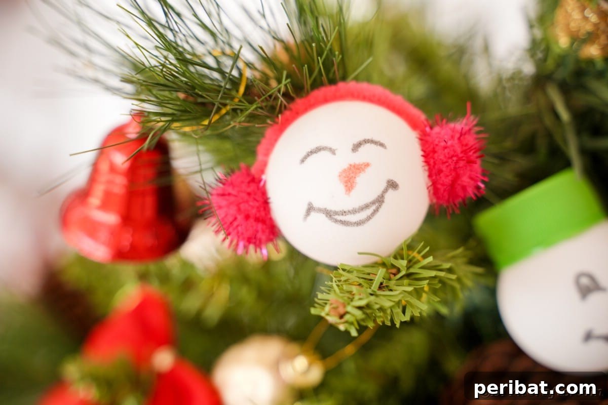 Handcrafted Ping Pong Snowman Holiday Ornaments 4 Ping pong snowman face on tree