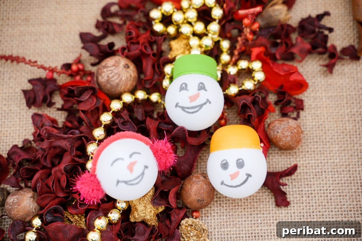 Handcrafted Ping Pong Snowman Holiday Ornaments 5 Ping pong ball ornaments on table