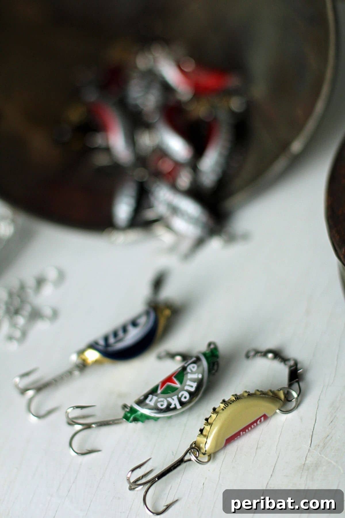 Unique fishing lures crafted from colorful bottle caps, a clever gift for fishermen.