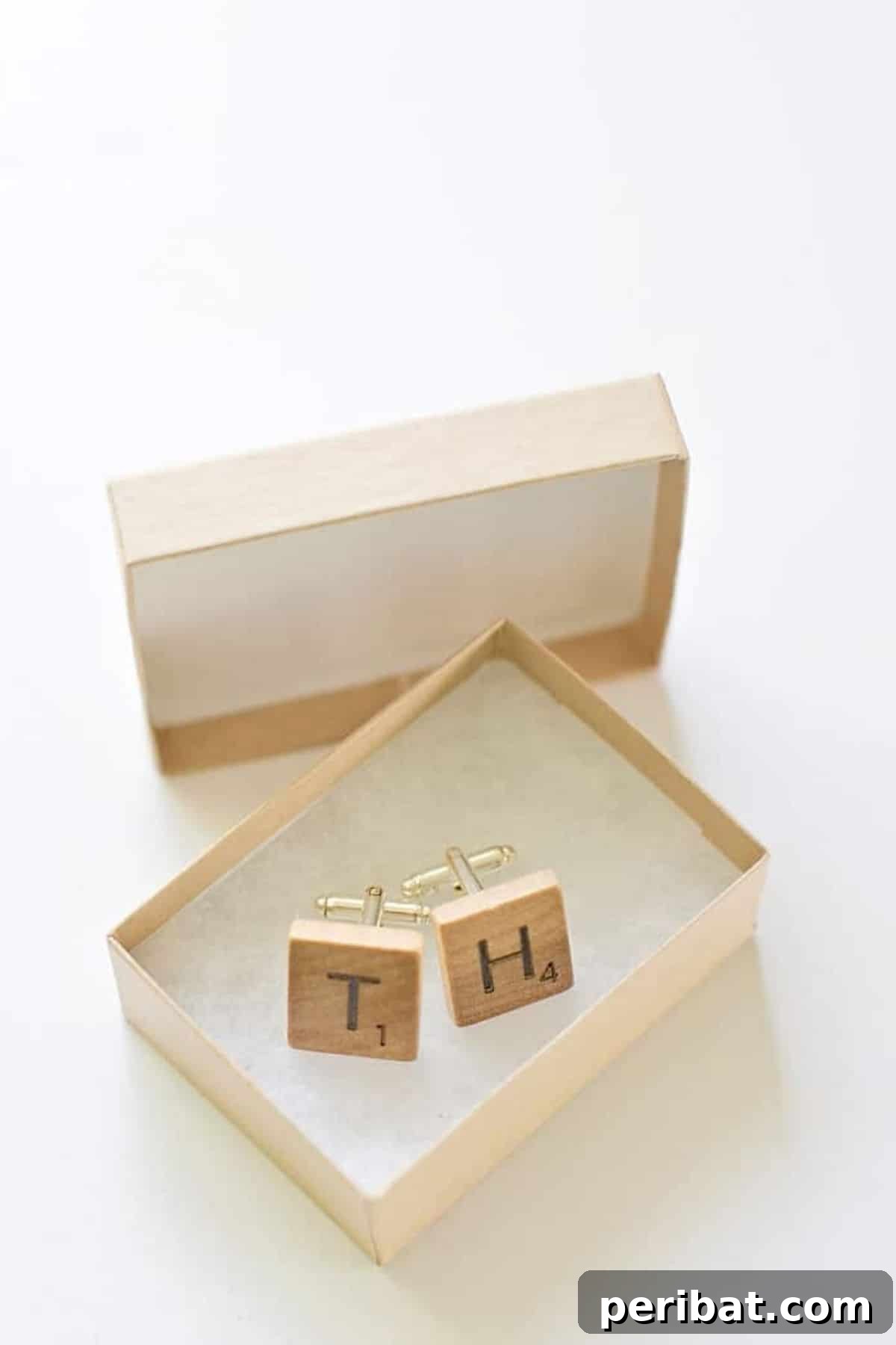 Stylish cuff links made from Scrabble tiles, customized with initials, a clever and personalized accessory.