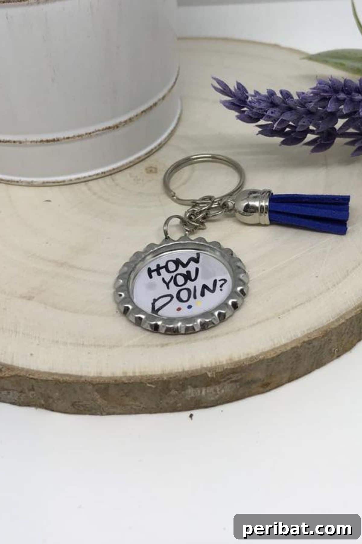 A personalized keychain made from a bottle cap featuring the 'Friends' TV show logo, a fun gift for fans.