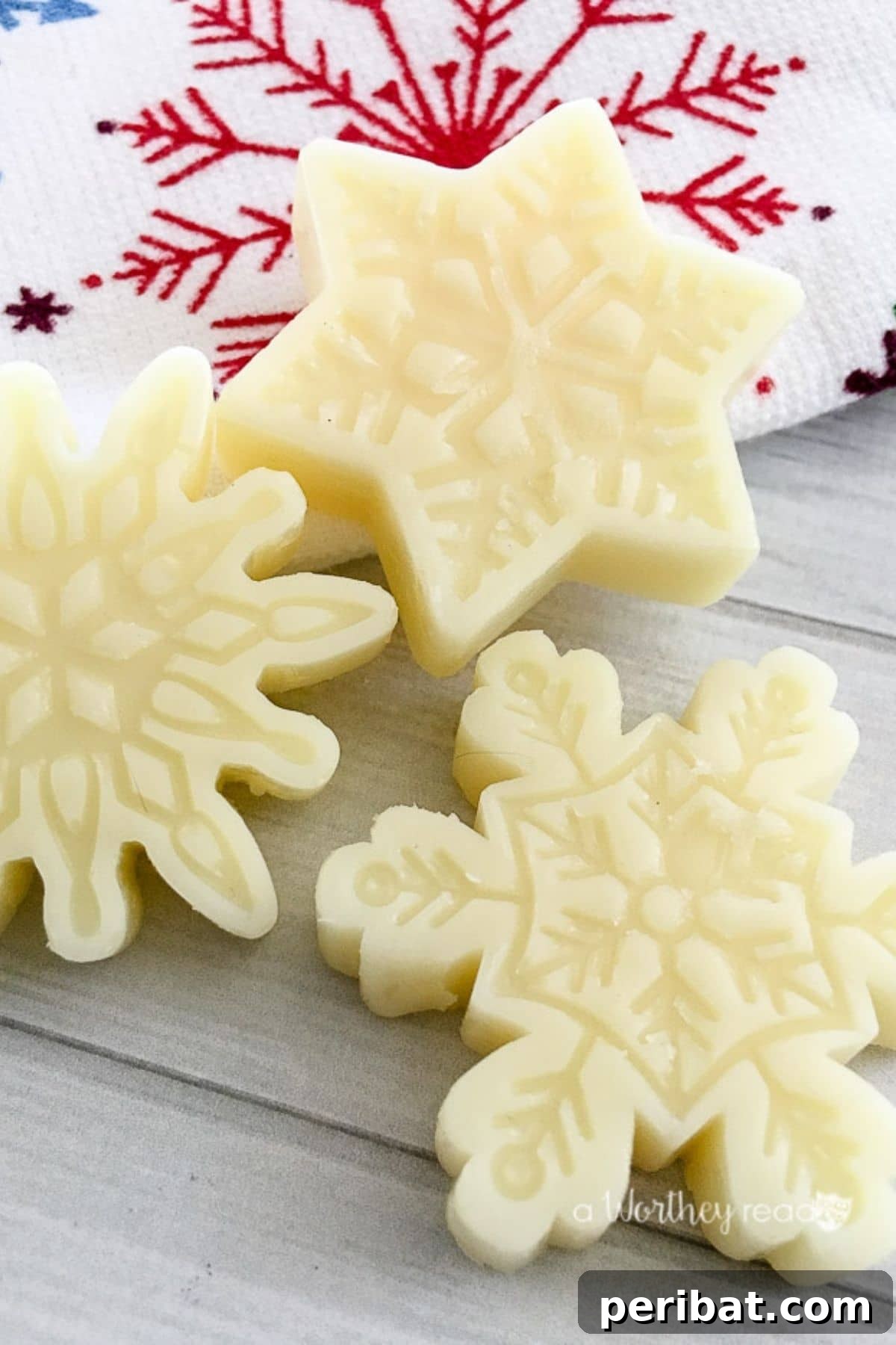 Delicate snowflake-shaped lotion bars, offering a moisturizing and handmade gift idea.