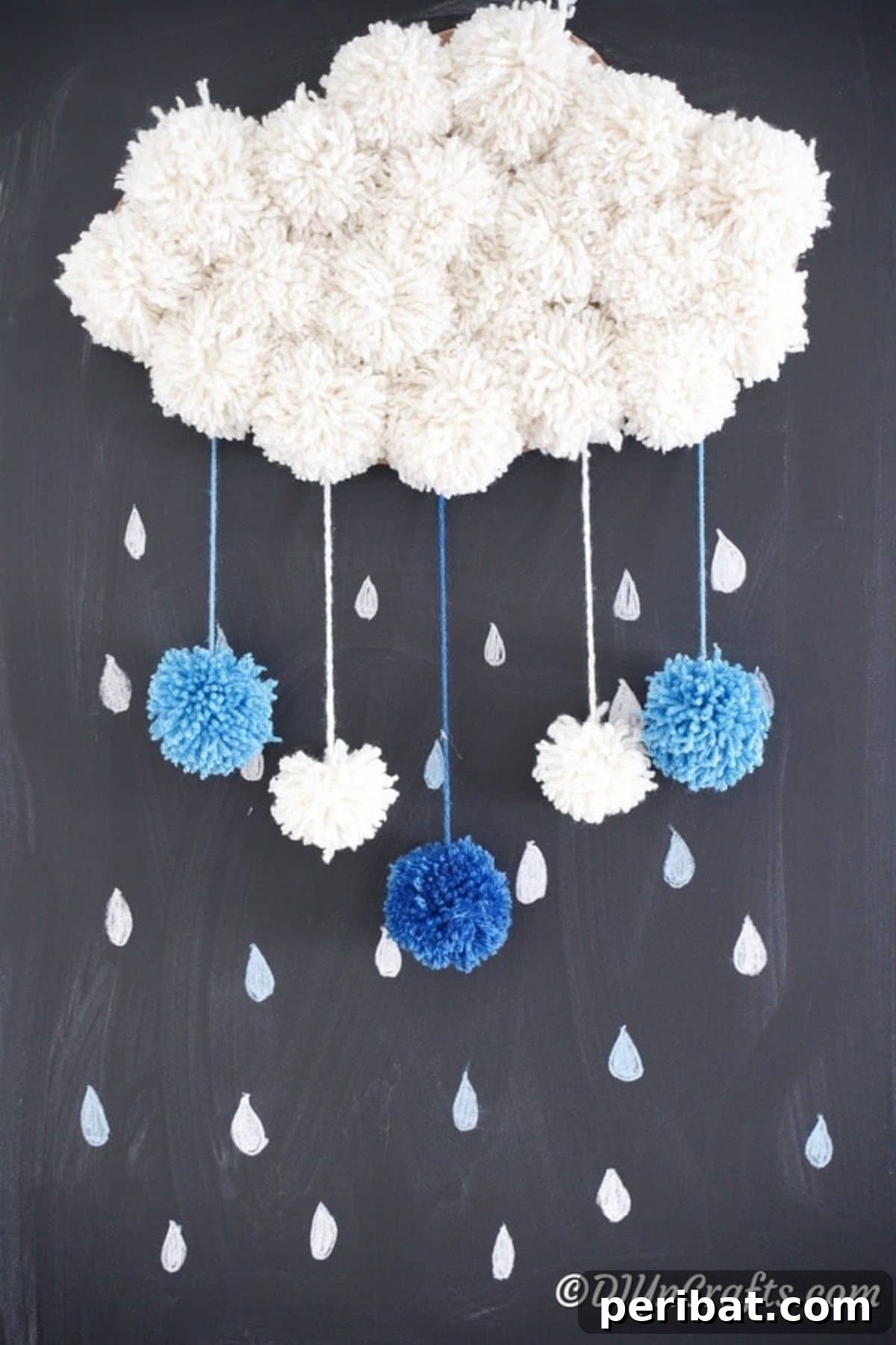 A whimsical pom pom cloud wall art piece, adorned with colorful pom poms, creating a soft and dreamy DIY decor element for a child's bedroom.