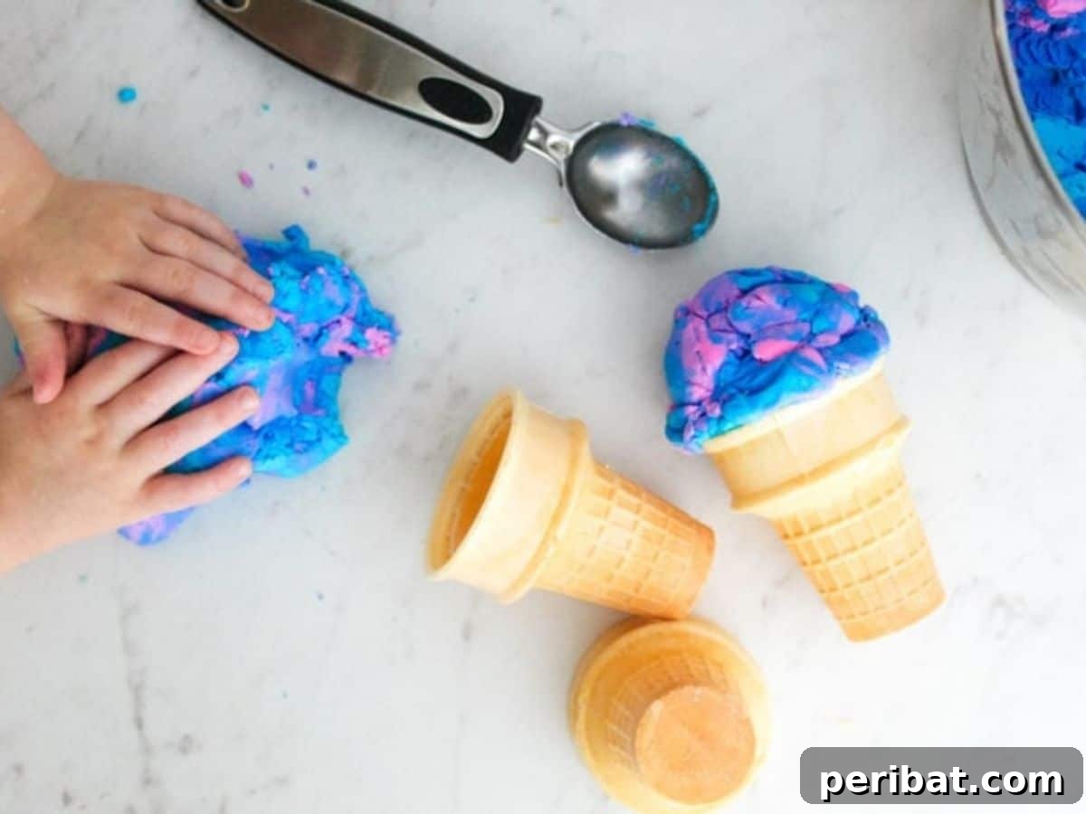 Colorful edible playdough in an ice cream cone, a safe and engaging sensory play activity for children, perfect for creative exploration.