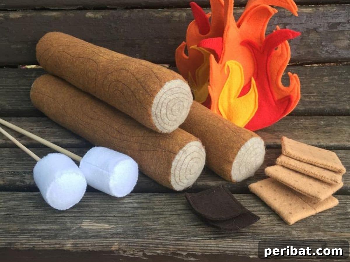 A charming felt bonfire S'mores kit for kids, featuring a felt fire, logs, marshmallows, and graham crackers, perfect for imaginative indoor camping and cooking play.