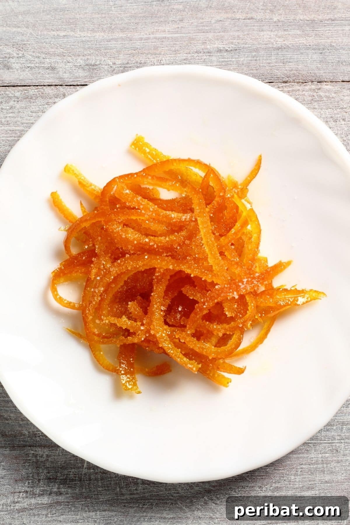 Orange peels on a white plate ready for zesting