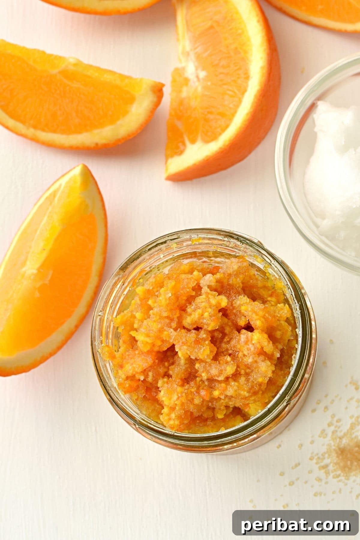 Orange sugar scrub in a glass jar