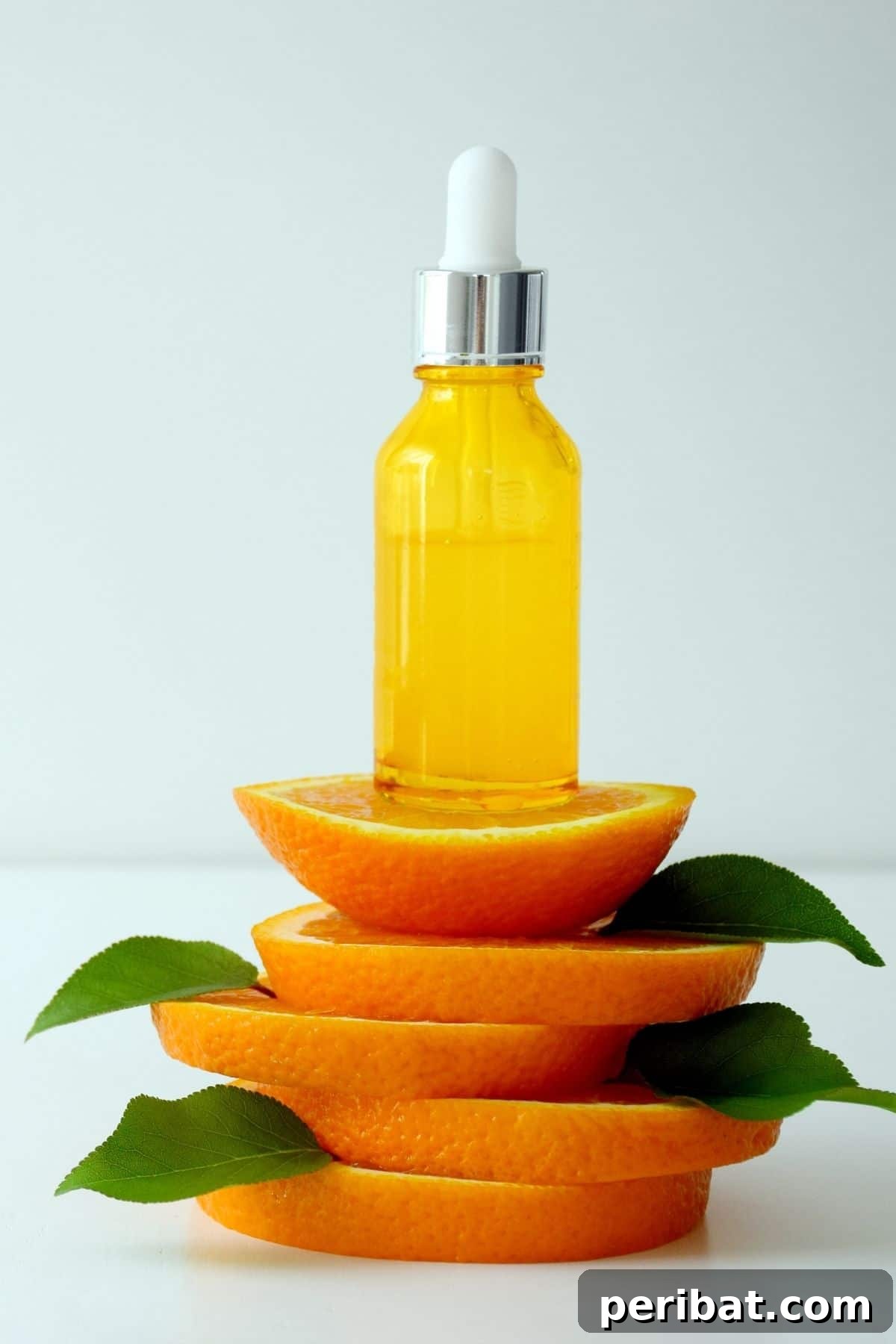Small bottle of homemade orange oil with peels