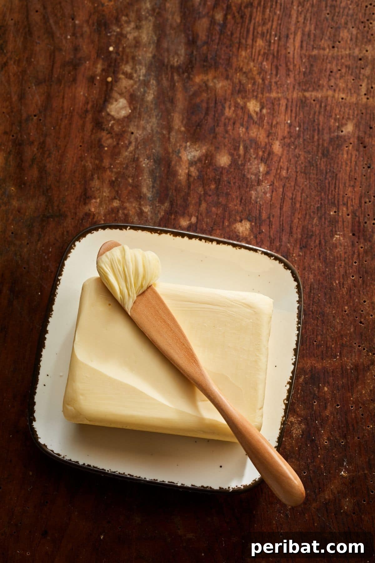Orange butter in a small dish with orange zest