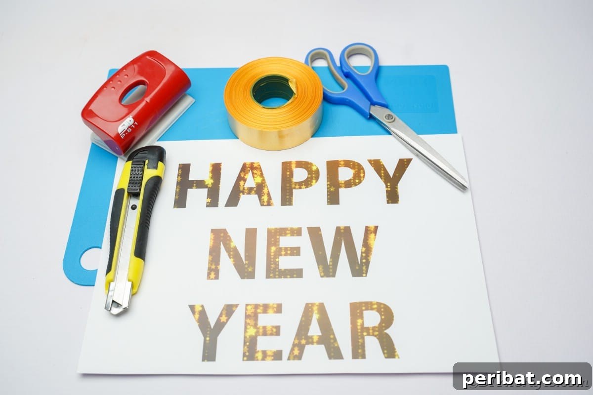 Free Printable Happy New Year Banner Instant 10 Minute Setup 6 Arrangement of craft supplies including cardstock, ribbon, scissors, and a hole punch, ready for creating a New Year banner.