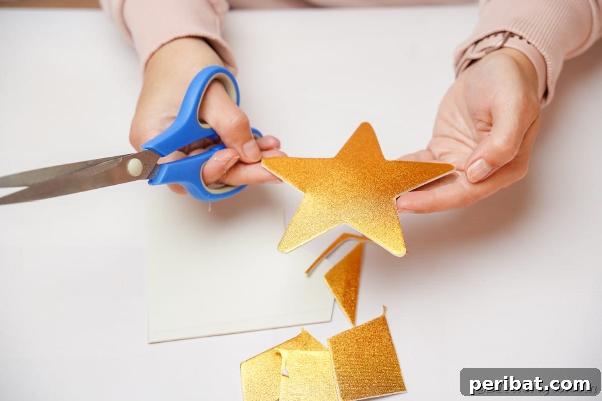 A woman proudly holding a freshly cut gold glitter star, a key decorative element.