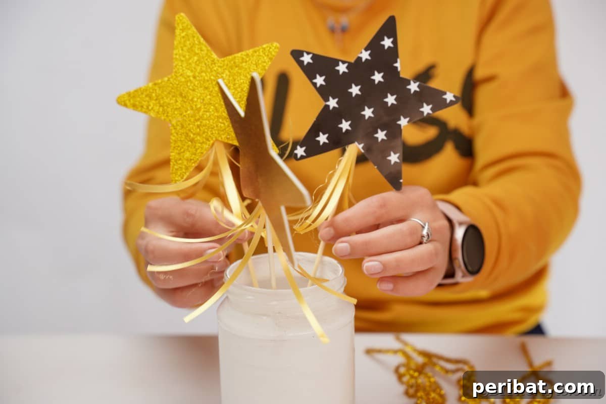 A woman thoughtfully decorating a mason jar centerpiece with festive elements.