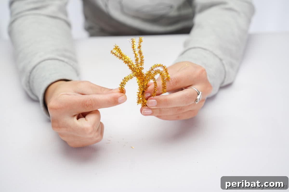 Twist Up a Dazzling Pipe Cleaner Fireworks Ring 12 Close-up of hands meticulously rolling down the ends of the pipe cleaner pieces to sculpt them into a distinct fireworks shape