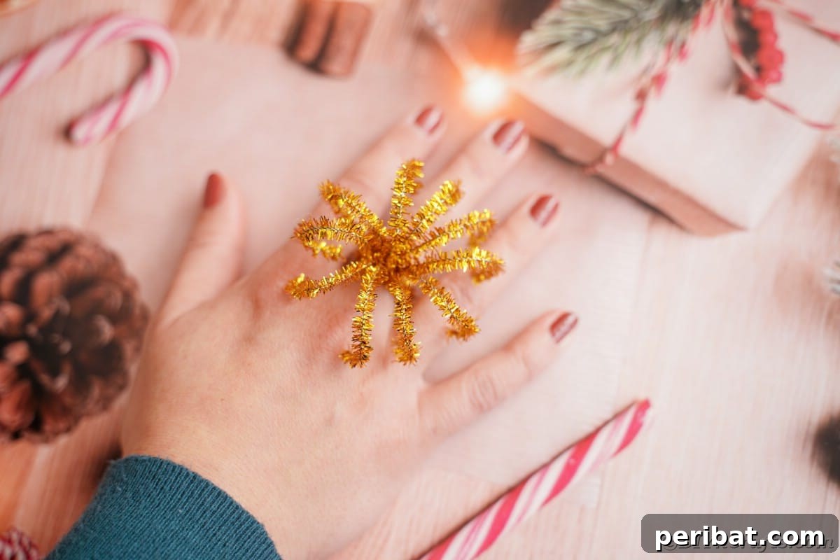Twist Up a Dazzling Pipe Cleaner Fireworks Ring 5 A vibrant pipe cleaner fireworks ring worn on a hand, against a soft, unfocused background, highlighting its texture and color