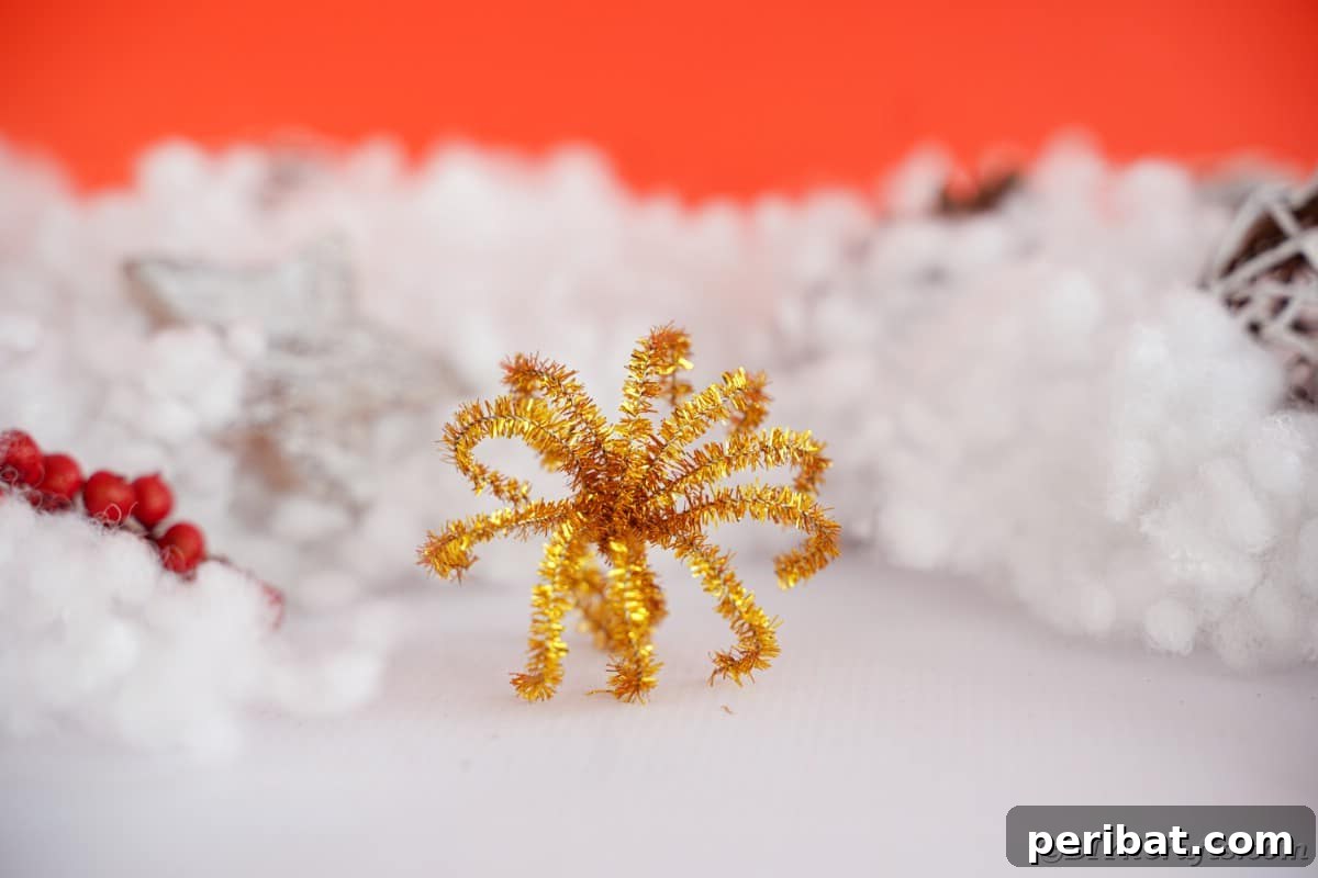 Twist Up a Dazzling Pipe Cleaner Fireworks Ring 6 A colourful pipe cleaner fireworks ring resting on a clean white surface, showcasing its intricate details