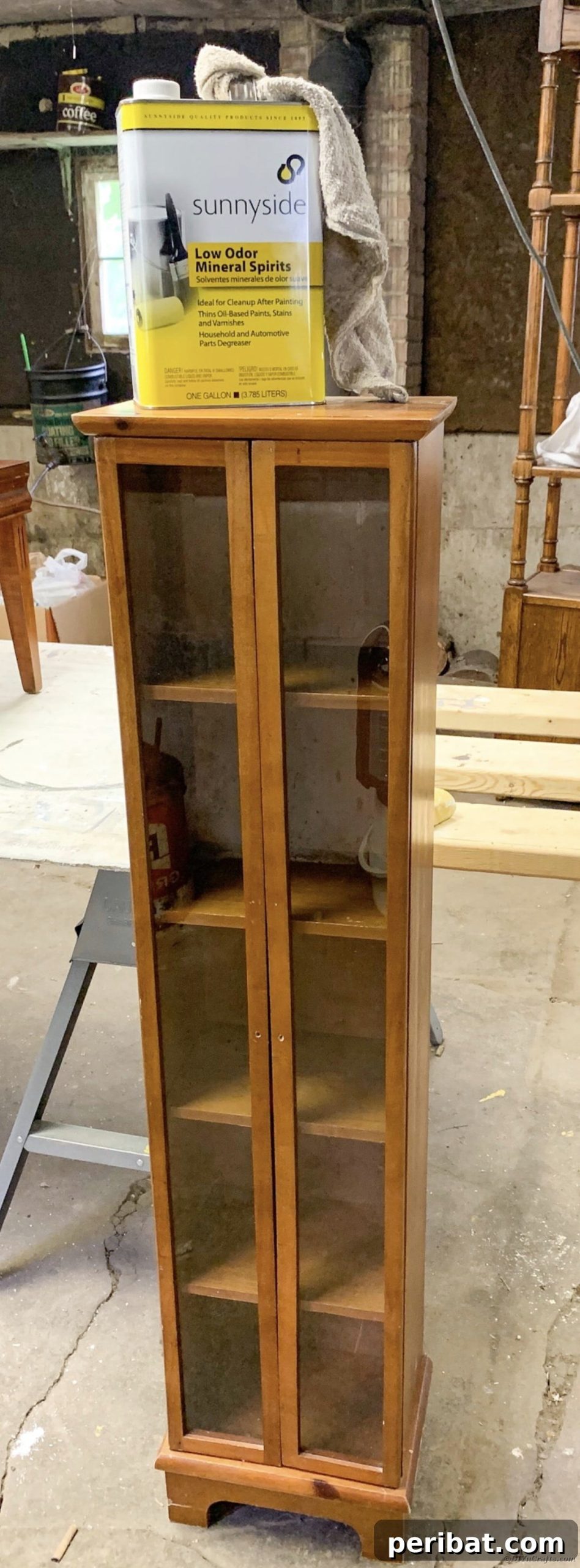 Curio cabinet before restoration work begins