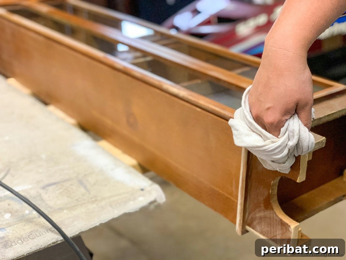 Cleaning dust from curio cabinet after sanding