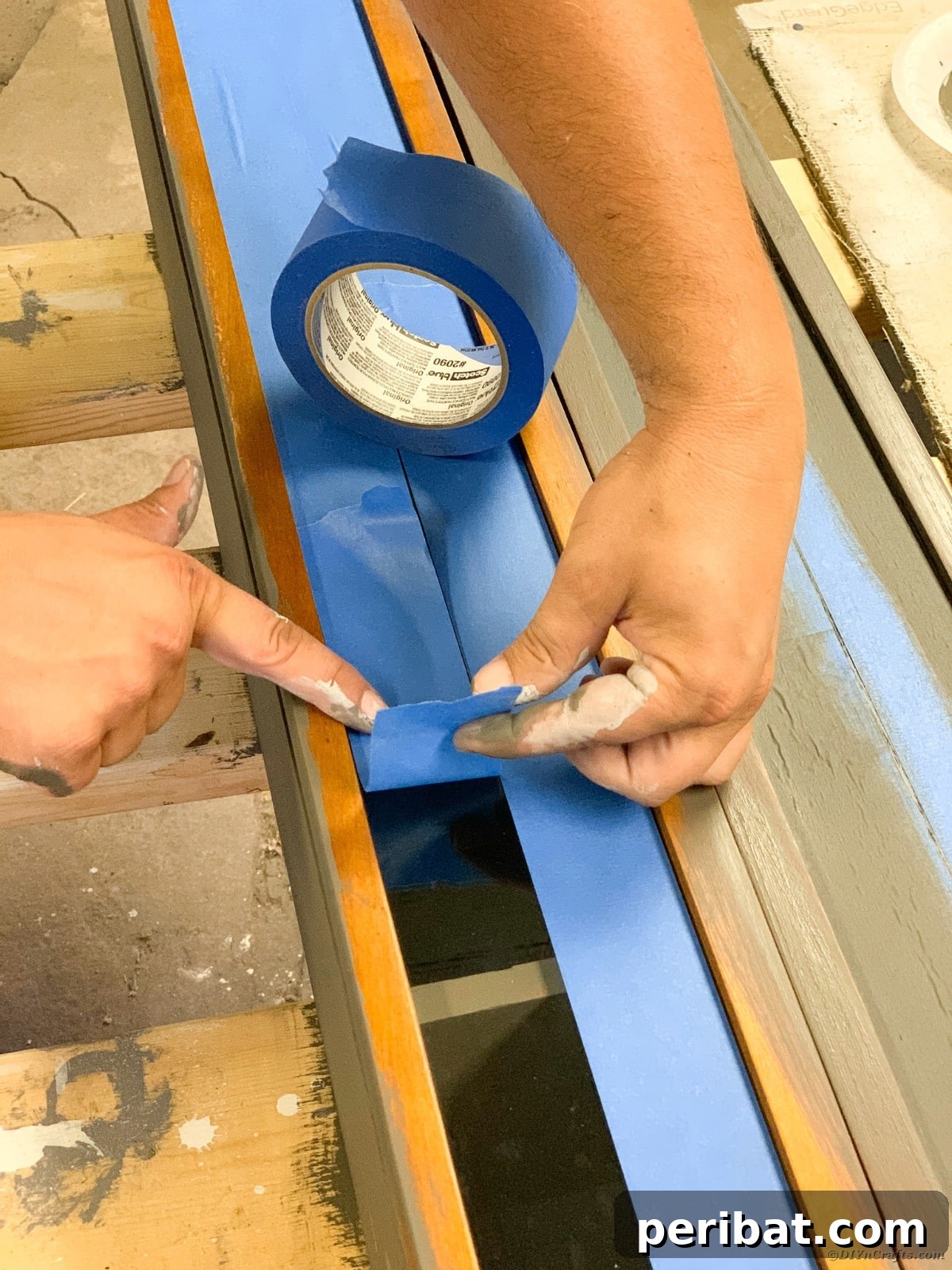Adding painter's tape to the curio cabinet glass
