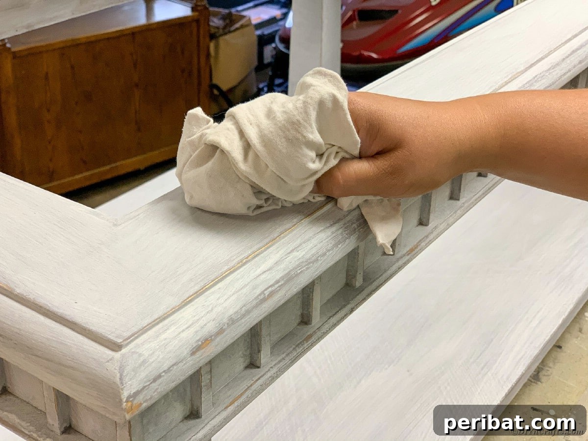 Wiping away sanding dust from the table