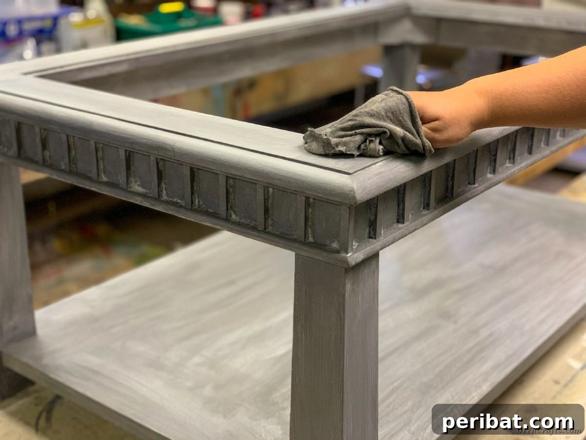 Wiping down a table after sanding