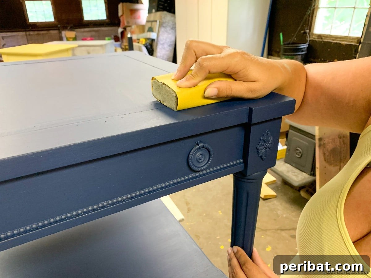 Light sanding of the painted table to ensure a smooth surface