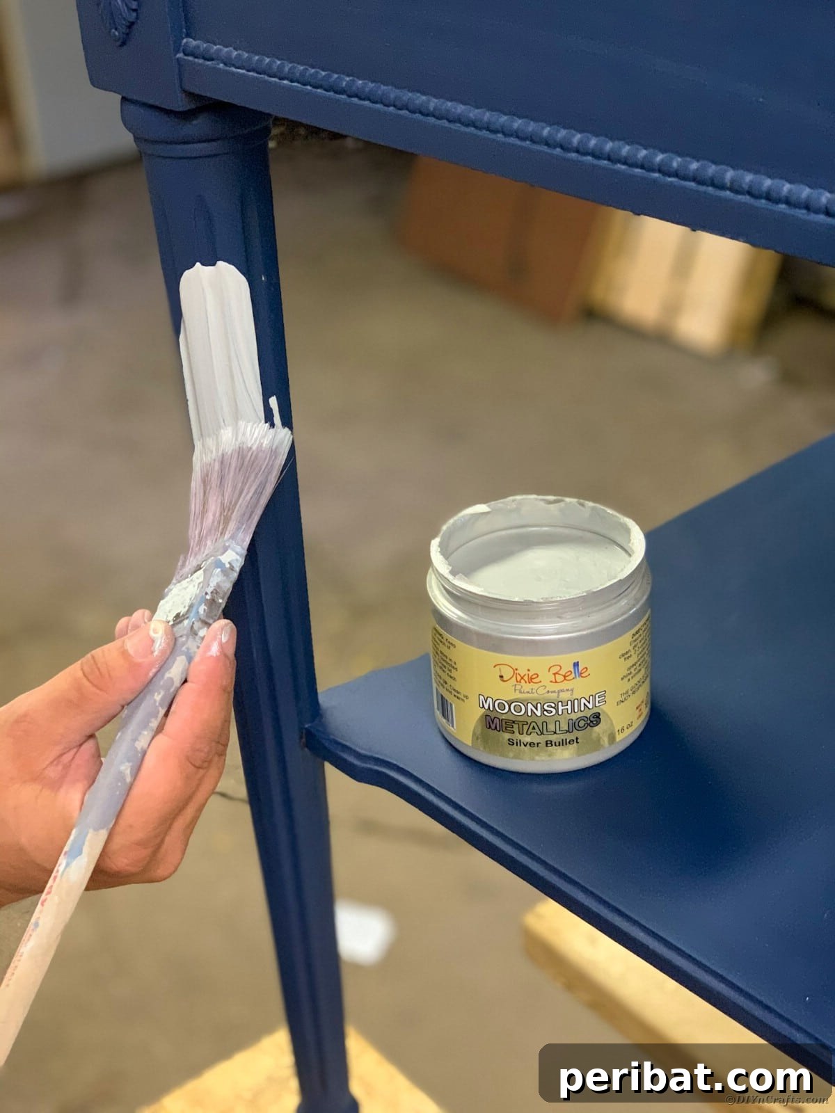 Applying metallic silver bullet paint to the side table