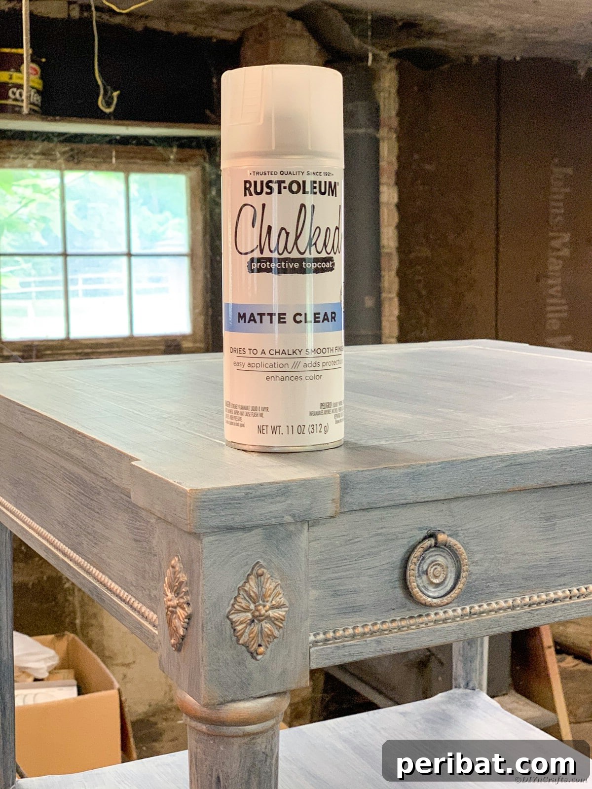 Applying clear protective topcoat to the metallic and waxed areas of the table