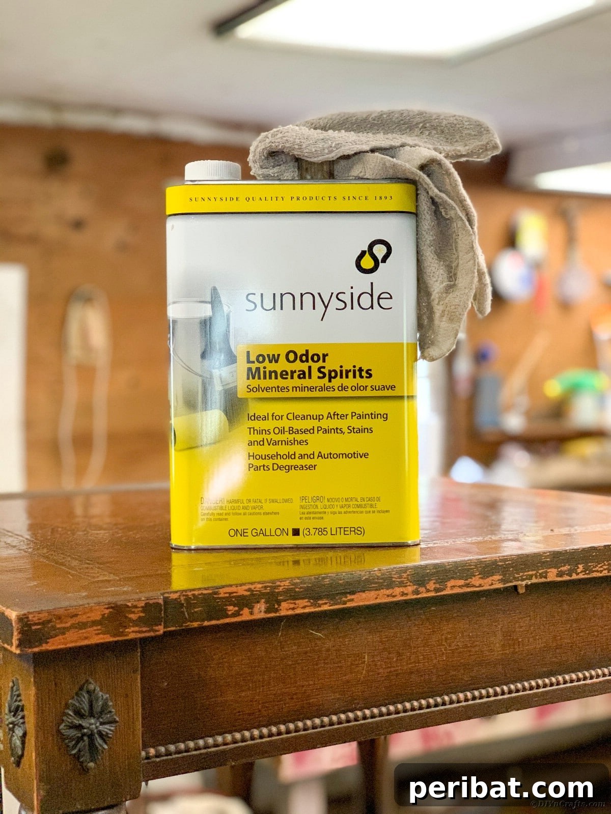 Cleaning table with mineral spirits to remove debris and oils