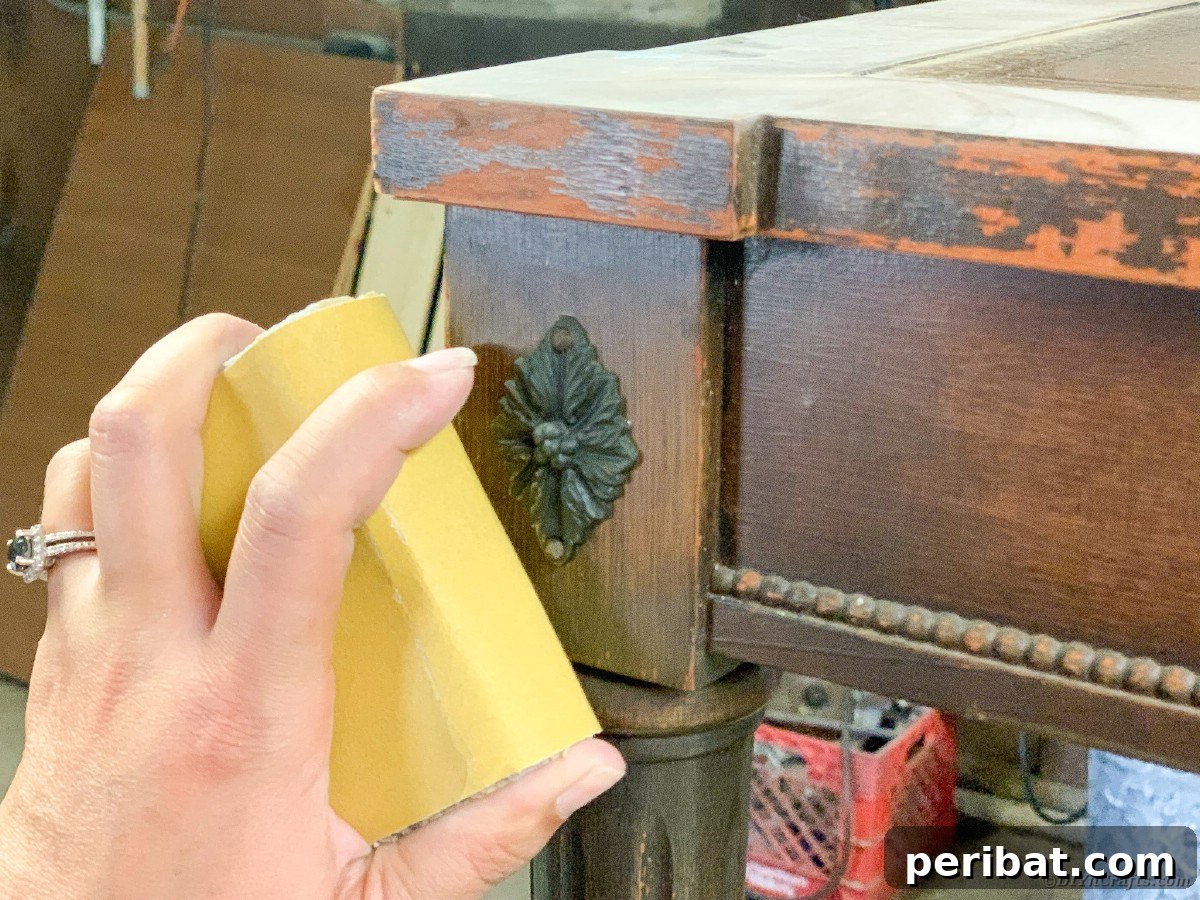 Detailed sanding process on table edges and surfaces