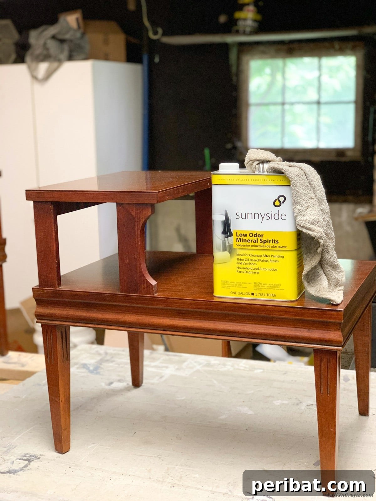 Mid Century End Table Makeover: A Step-by-Step Guide 5 Wiping table with mineral spirits