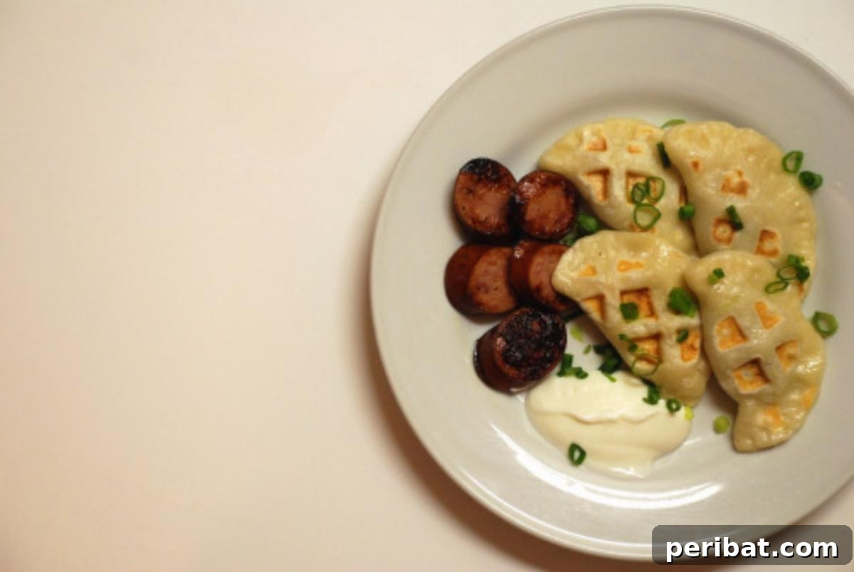 Delicious pierogies cooked in a waffle iron, showing a perfectly golden and textured exterior, ready to be served.