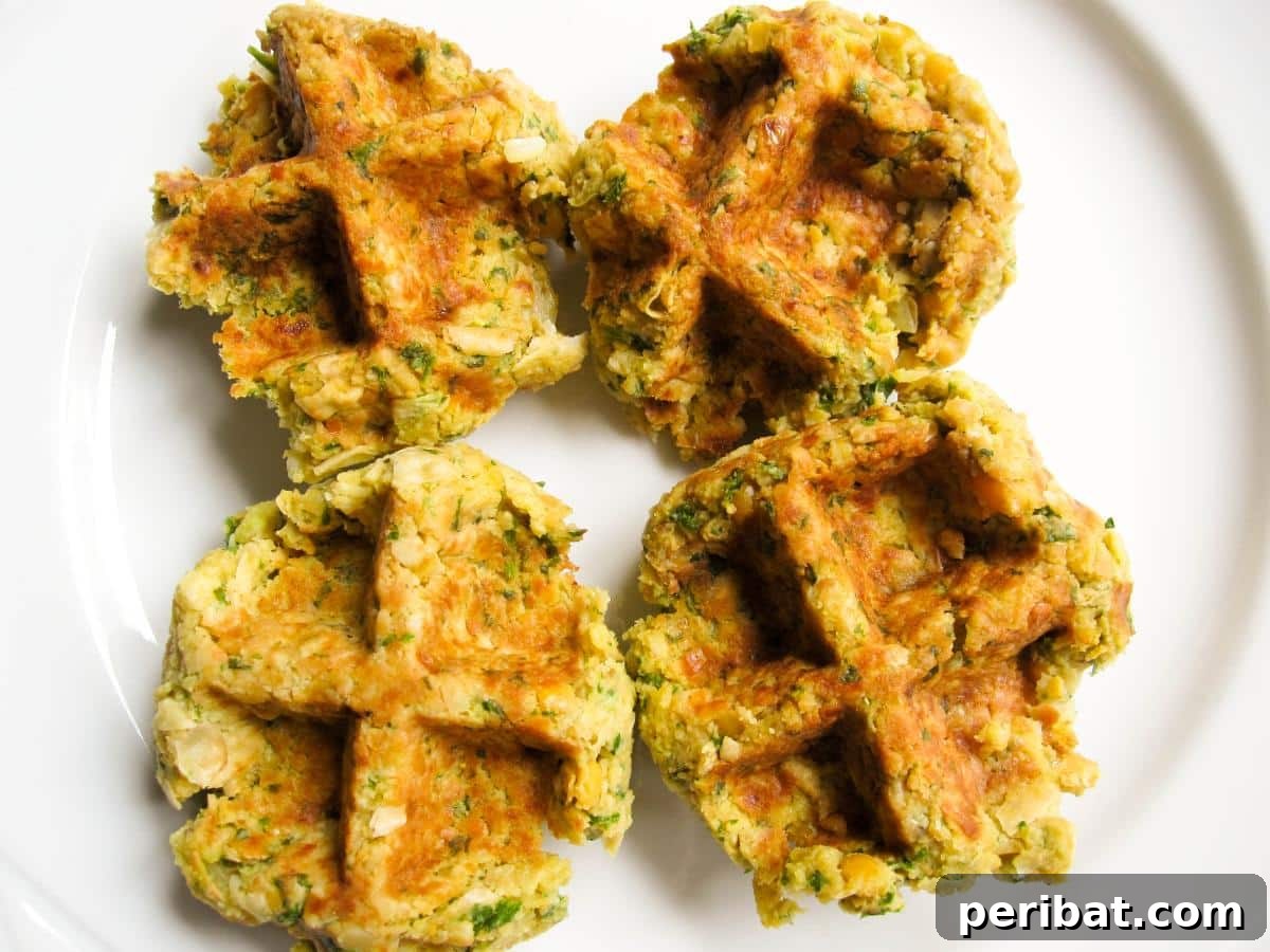 Crispy waffled falafel with a vibrant tzatziki sauce and lemon rice, offering a unique and authentic Middle Eastern meal.
