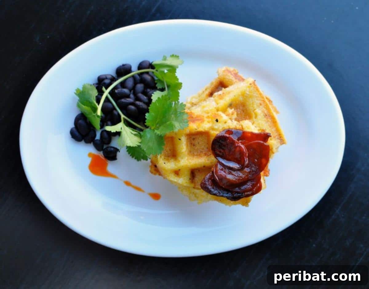 Beautifully textured waffled polenta, garnished with fresh herbs, showcasing its elegant presentation and crispy edges.