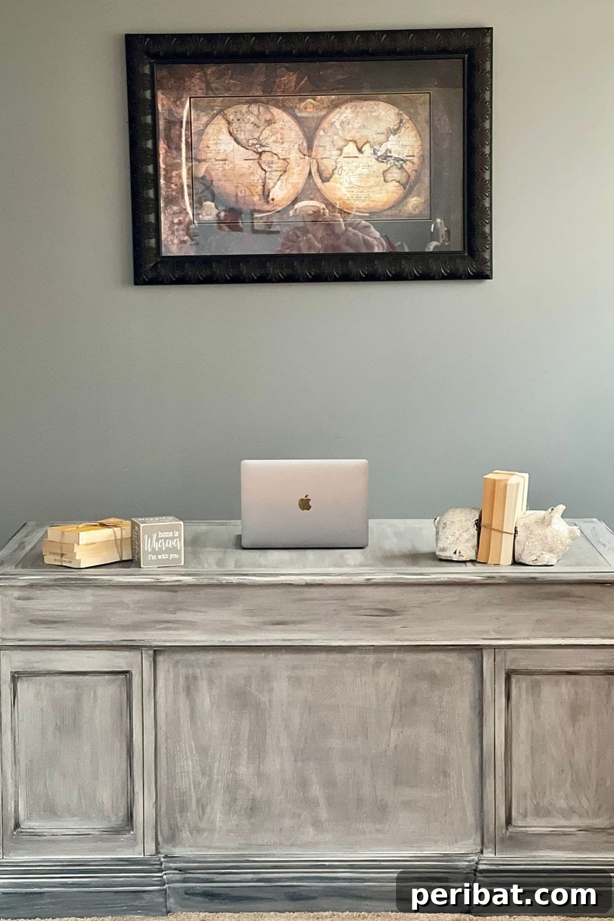 Distressed wood desk with a modern farmhouse aesthetic, perfectly restored and ready for use in a home office.