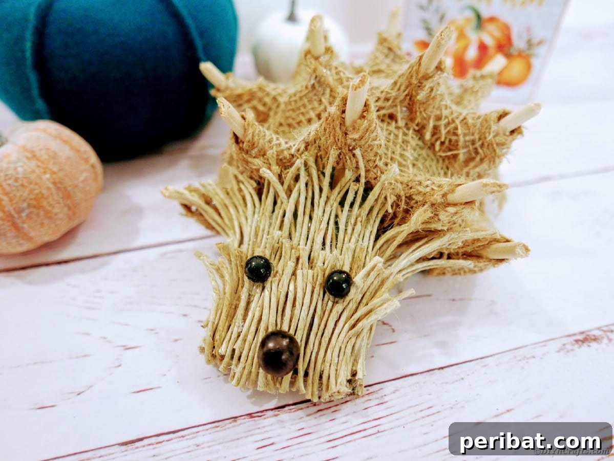 Create a Charming Burlap Hedgehog Decoration 2 Rustic burlap hedgehog decoration on a wooden table, perfect for woodland themed decor