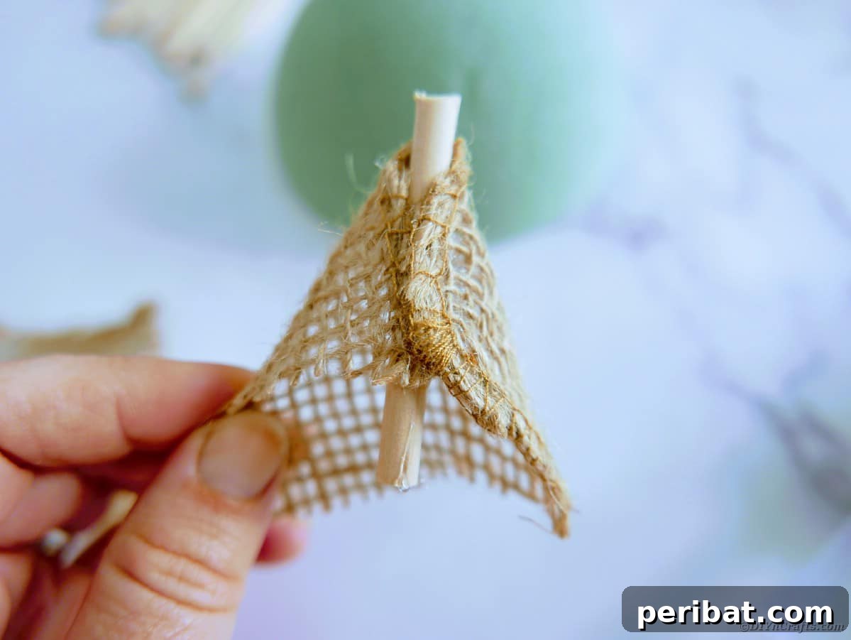 Create a Charming Burlap Hedgehog Decoration 16 Wrapping wooden dowel pieces with burlap ribbon using hot glue