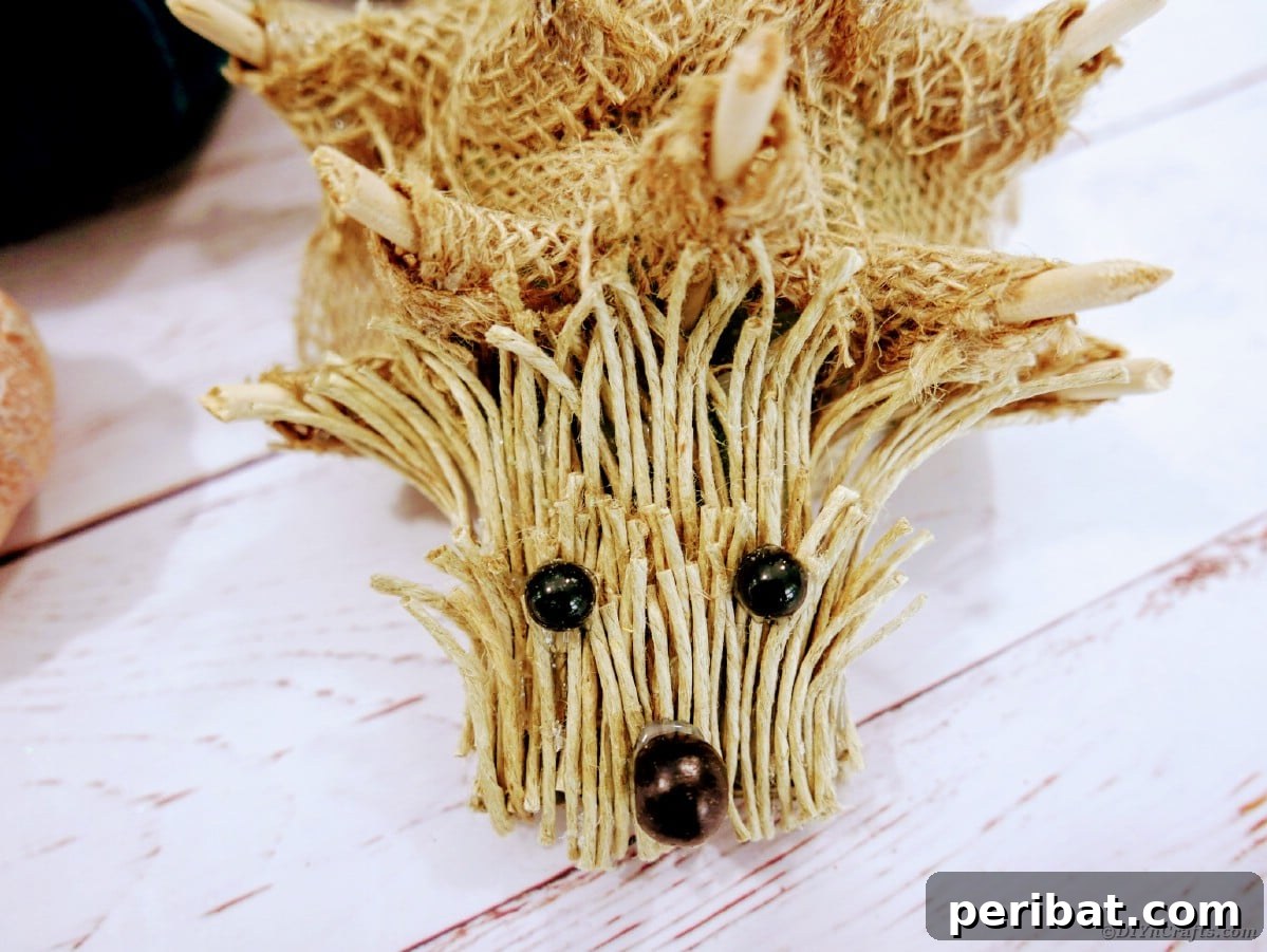 Create a Charming Burlap Hedgehog Decoration 3 Handmade burlap hedgehog with twine spikes on a rustic wooden surface