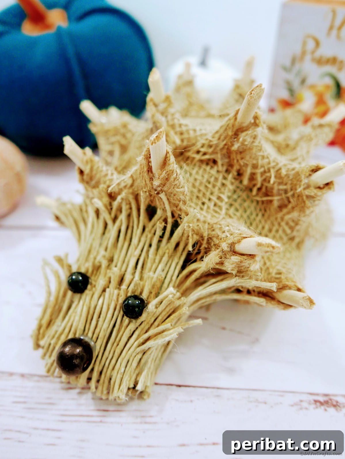 Create a Charming Burlap Hedgehog Decoration 23 Burlap hedgehog craft displayed with colorful burlap ribbon accents