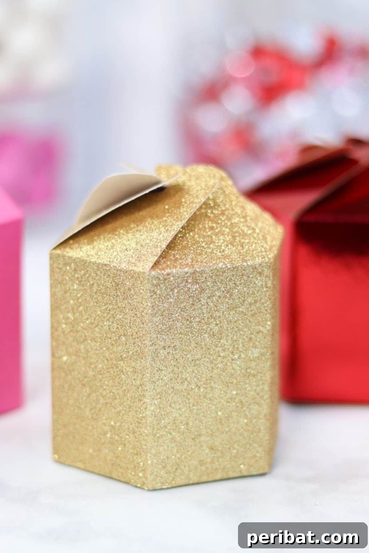 Crafty Cupid: Valentine's Day Gifts Kids Can Make 12 Elegant paper gift boxes with intricate designs made using a Cricut machine for Valentine's Day