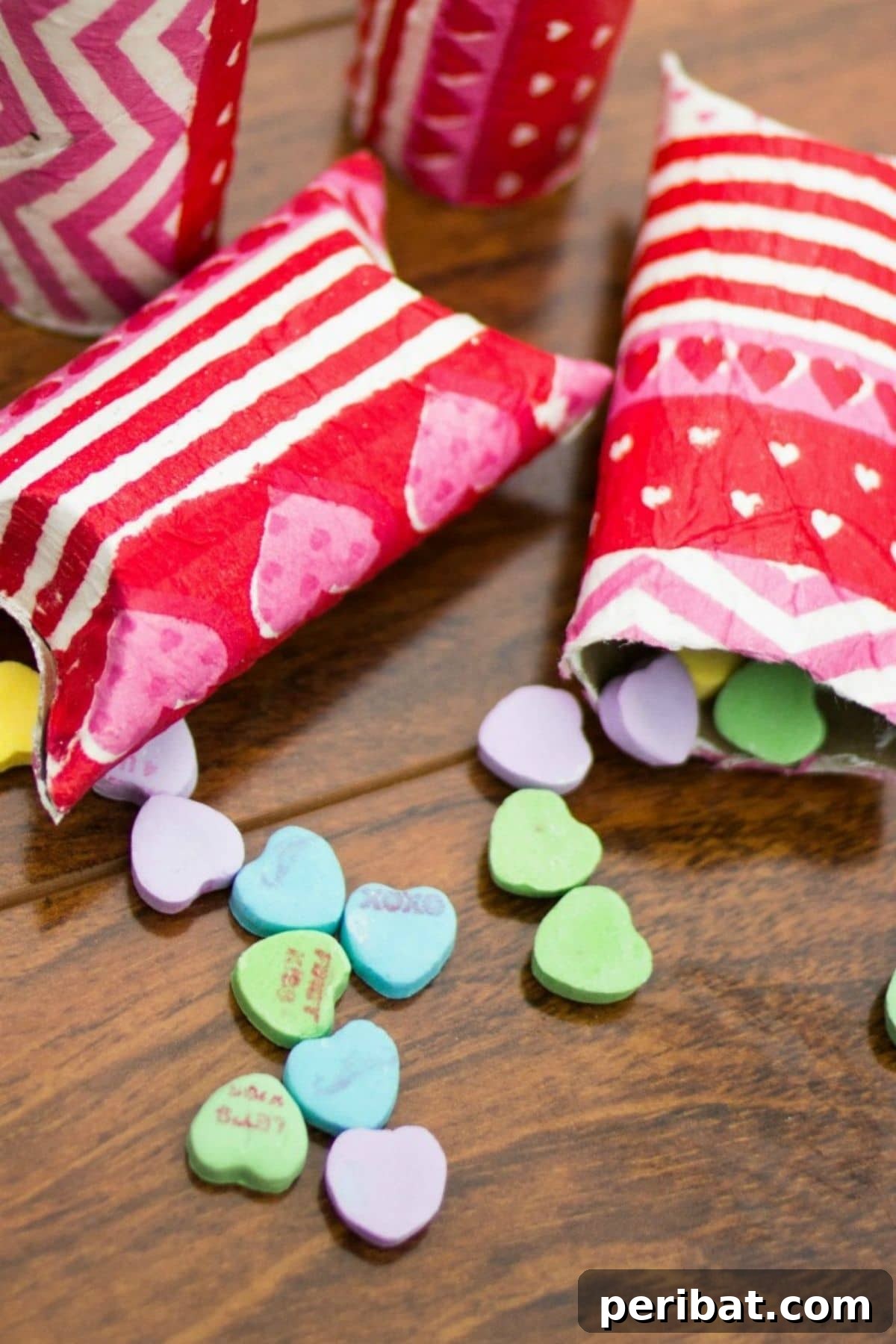 Crafty Cupid: Valentine's Day Gifts Kids Can Make 8 Upcycled toilet paper roll crafted into a cute pillow treat box for Valentine's Day candies