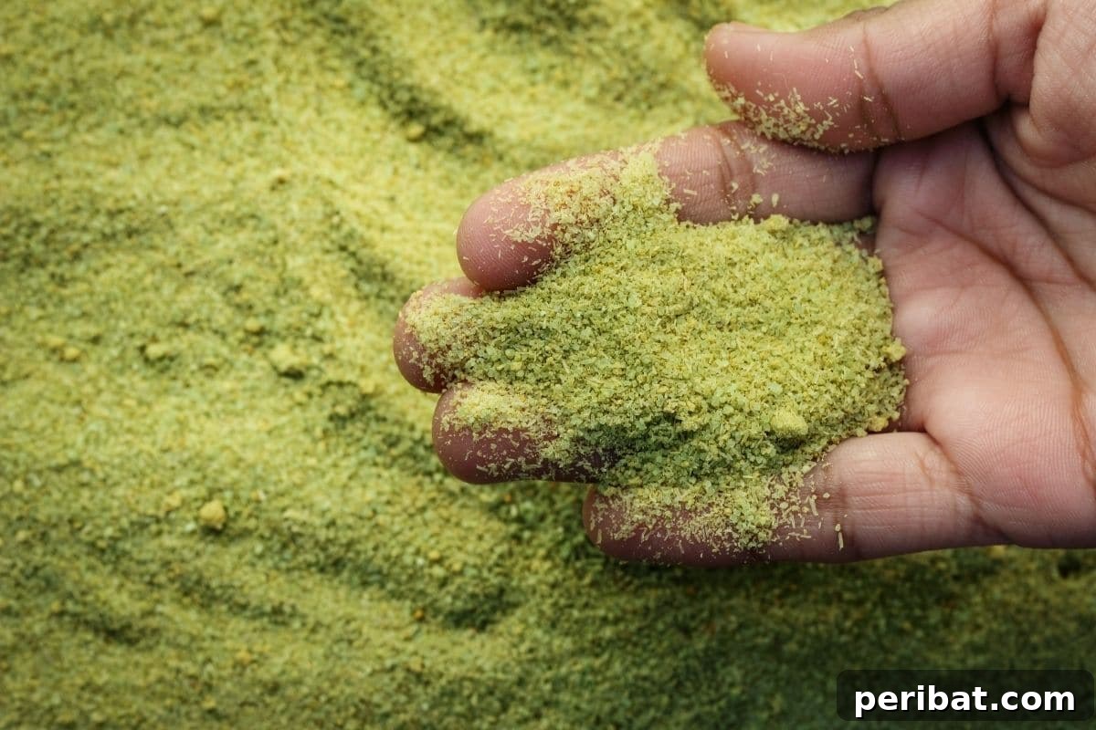 15 Expert Strategies for Pre-Planting Soil Improvement 20 holding a greensand fertilizer