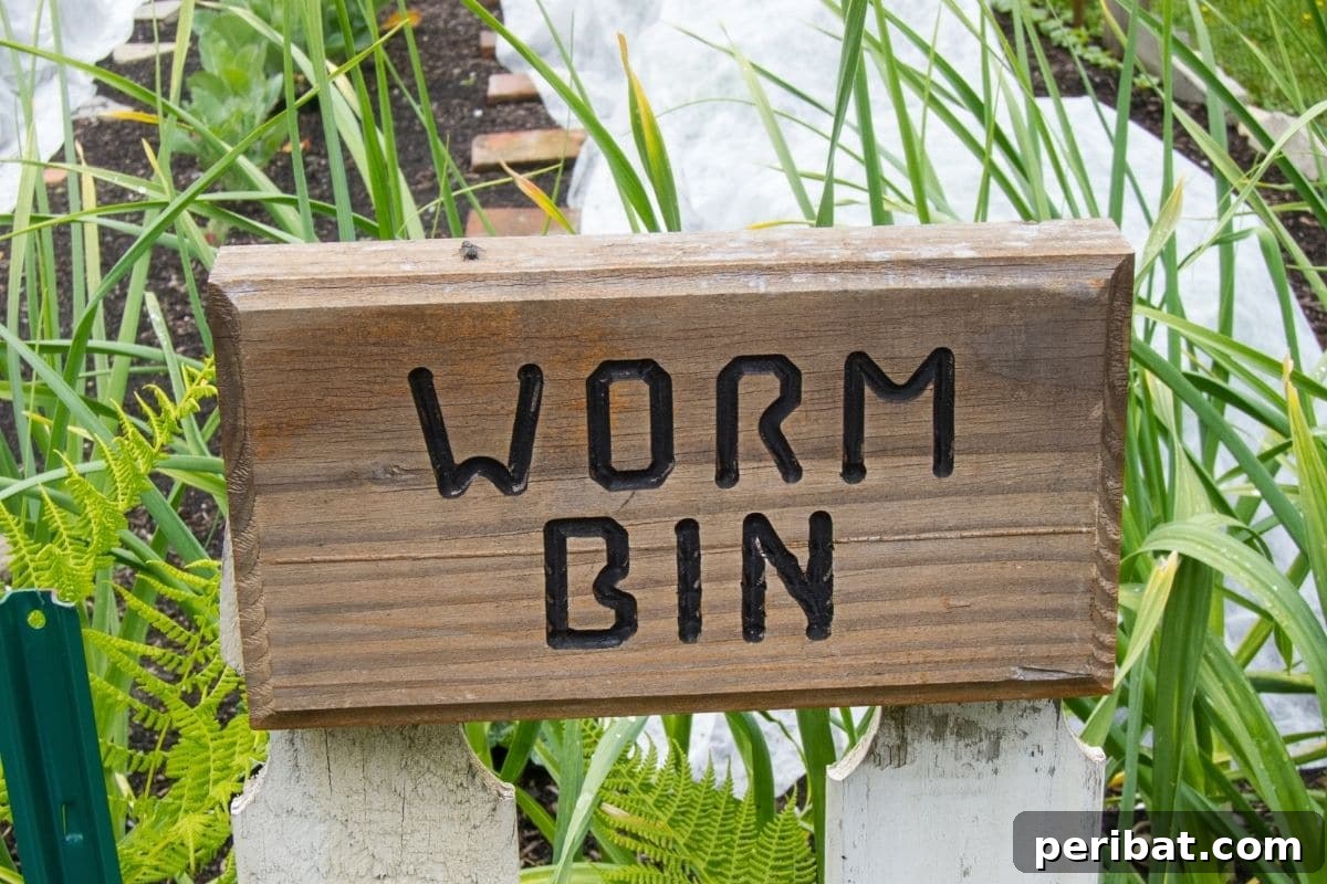 13 Clever Tea Bag Uses for a Healthier Garden 14 A sign indicating a worm composting bin, emphasizing sustainable waste management.